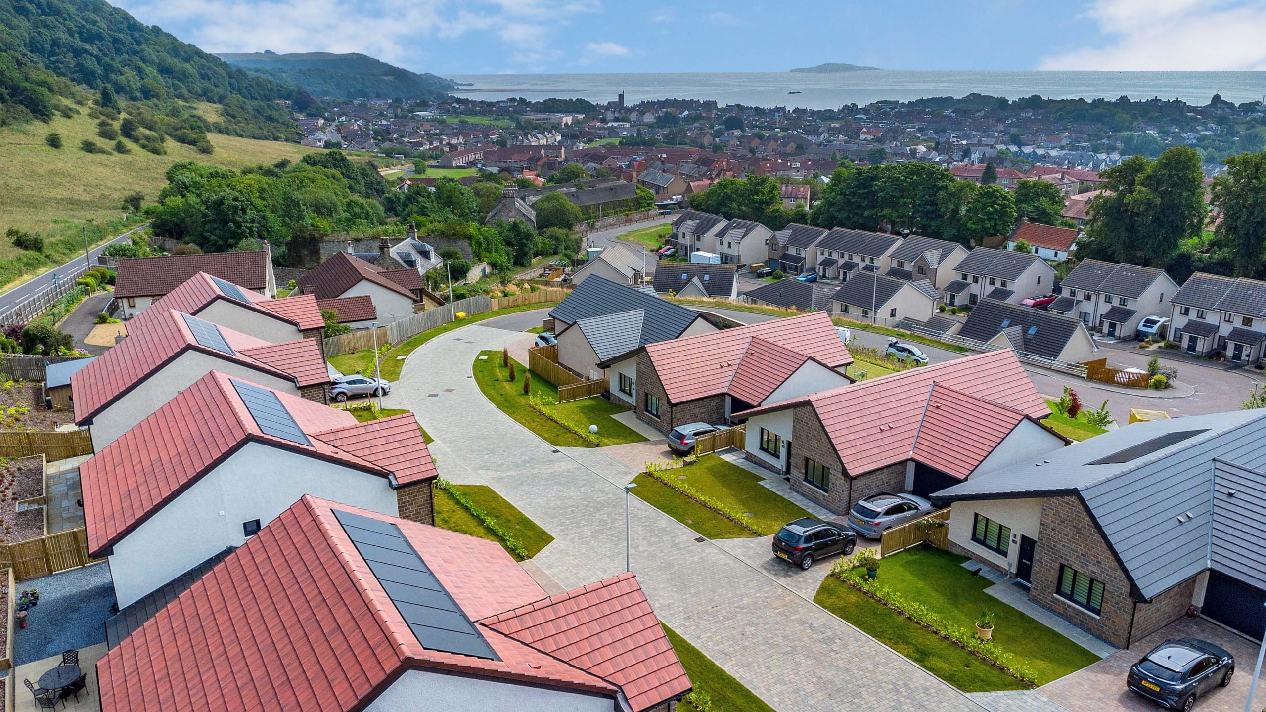 Ariel of new build homes in Fife. Mix of bungalows and two story homes in Burntisland.