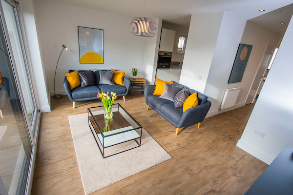 Allanbank, Lauder New Build Home. Colourful Living room with open plan spa\ce into kitchen/dining area and patio doors to garden