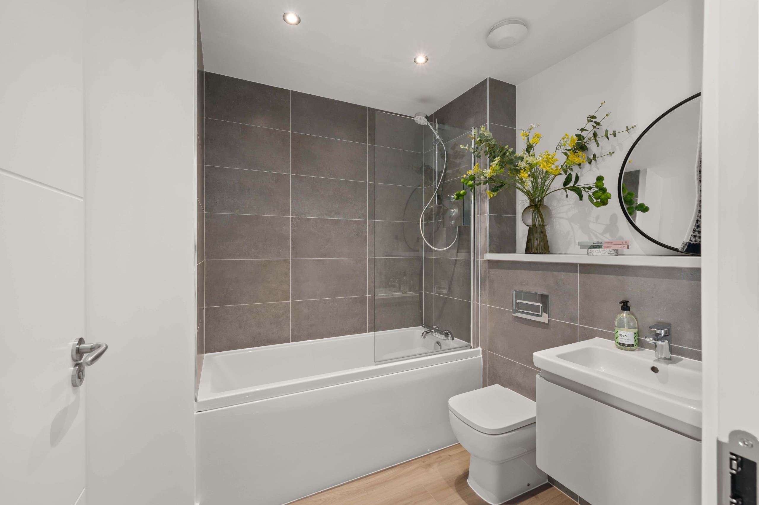 Viewforth, Kirkcaldy, Fife. FAmily bathroom with grey tiling and white sanitaryware